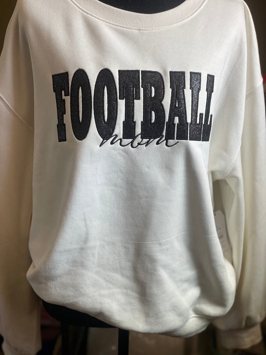 Cream embroidered crewneck reading FOOTBALL mom in black lettering
